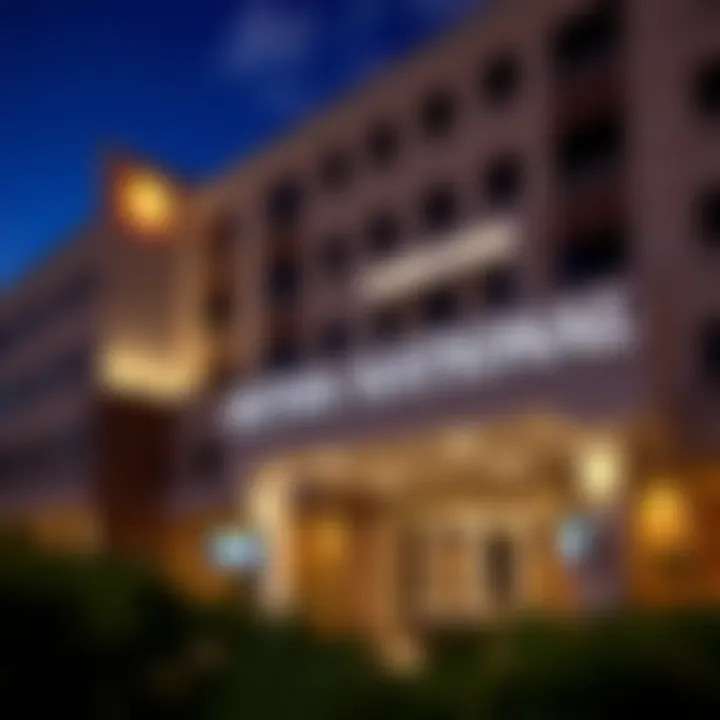 Exterior view of a modern hotel near Penn National Casino with illuminated signage at dusk